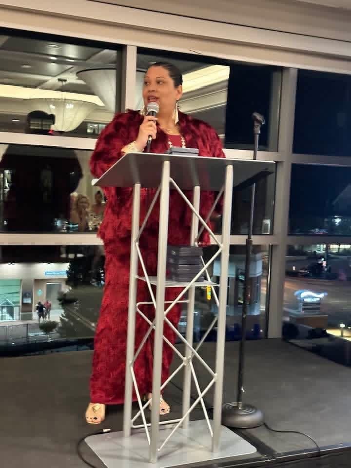 Natalie Donnally delivering a keynote at a speaking engagement